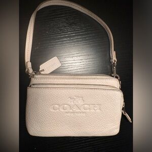 Coach wristlet , cream color